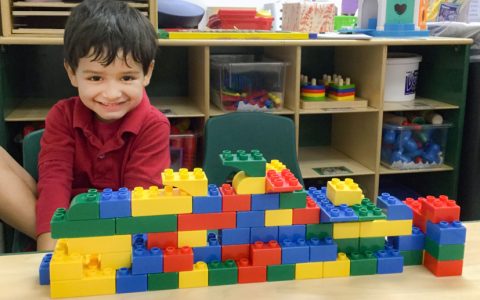 child playing lego