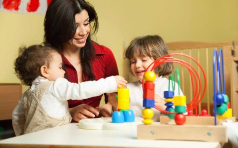 teacher playing with children
