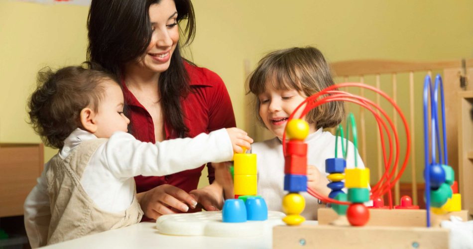 teacher playing with children