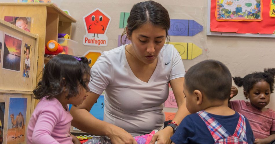 child putting on shoe